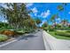 Landscaped entrance to Pinestone community at 4275 Castlebridge Ln # 1312B1, Sarasota, FL 34238