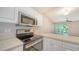 Stainless steel appliances and white cabinetry in kitchen at 4275 Castlebridge Ln # 1312B1, Sarasota, FL 34238
