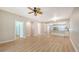 Open living area with wood-look floors and kitchen views at 4275 Castlebridge Ln # 1312B1, Sarasota, FL 34238