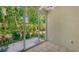Sliding glass doors open to a private patio at 4275 Castlebridge Ln # 1312B1, Sarasota, FL 34238