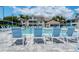Relaxing pool area with numerous lounge chairs at 4275 Castlebridge Ln # 1312B1, Sarasota, FL 34238