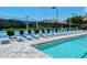 Refreshing pool area with numerous lounge chairs for residents at 4275 Castlebridge Ln # 1312B1, Sarasota, FL 34238
