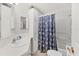 Clean bathroom with shower/tub combo, vanity, and linen cabinet at 4316 12Th Street E Ct, Ellenton, FL 34222