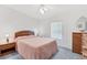 Cozy guest bedroom with a queen bed and wood dresser at 4316 12Th Street E Ct, Ellenton, FL 34222