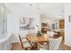 Bright dining room with hardwood floor and view into kitchen at 4316 12Th Street E Ct, Ellenton, FL 34222
