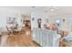 Open concept dining area with wood table and chairs, and views to living room at 4316 12Th Street E Ct, Ellenton, FL 34222