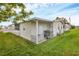 Side view of the mobile home showcasing landscaping at 4316 12Th Street E Ct, Ellenton, FL 34222