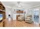 Spacious living room with hardwood floors, access to patio, and comfortable seating at 4316 12Th Street E Ct, Ellenton, FL 34222