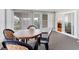 Sunroom with sliding doors leading to the outdoors and kitchen at 4316 12Th Street E Ct, Ellenton, FL 34222