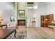 Bright living room with fireplace, hardwood floors, and ample natural light at 4699 Chandlers Forde # 23, Sarasota, FL 34235