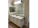Bathroom with white vanity, large mirror, and bathtub at 4802 51St W St # 708, Bradenton, FL 34210