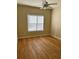 Bedroom with light walls, wood-look flooring, and ceiling fan at 4802 51St W St # 708, Bradenton, FL 34210