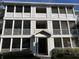 Three-story building exterior with screened balconies and landscaping at 4802 51St W St # 708, Bradenton, FL 34210