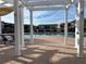Community pool with pergola and lounge chairs at 4802 51St W St # 708, Bradenton, FL 34210