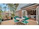 Deck with table and chairs, providing access to the kitchen at 4892 Peregrine E Pt, Sarasota, FL 34231