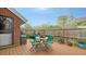 Deck with table and chairs, surrounded by a wooden fence at 4892 Peregrine E Pt, Sarasota, FL 34231