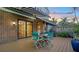Deck with table and chairs and a brick wall at 4892 Peregrine E Pt, Sarasota, FL 34231