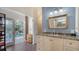Bright bathroom with granite countertop, updated vanity and pool view at 4892 Peregrine E Pt, Sarasota, FL 34231