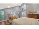 Spacious bedroom with hardwood floors and a view of the backyard at 4892 Peregrine E Pt, Sarasota, FL 34231