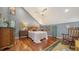 Main bedroom with hardwood floors and ceiling fan at 4892 Peregrine E Pt, Sarasota, FL 34231