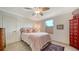 Cozy bedroom with a double bed, dresser, and ceiling fan at 4892 Peregrine E Pt, Sarasota, FL 34231