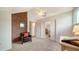 Bright bonus room featuring exposed brick wall and sitting area at 4892 Peregrine E Pt, Sarasota, FL 34231