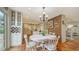 Kitchen breakfast nook with white table and chairs, adjacent to the kitchen at 4892 Peregrine E Pt, Sarasota, FL 34231