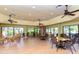 Relaxing community room with seating and bookshelves at 4892 Peregrine E Pt, Sarasota, FL 34231