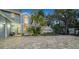 Two-story house featuring a large paved driveway and walkway at 4892 Peregrine E Pt, Sarasota, FL 34231