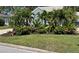 Charming house with a well-manicured lawn and tropical plants at 4892 Peregrine E Pt, Sarasota, FL 34231
