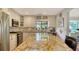 Spacious kitchen boasts granite countertops and stainless steel appliances at 4892 Peregrine E Pt, Sarasota, FL 34231