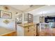 Updated kitchen with granite island, wine cooler, and white shaker cabinets at 4892 Peregrine E Pt, Sarasota, FL 34231