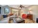 Spacious living room with a sectional sofa and access to kitchen at 4892 Peregrine E Pt, Sarasota, FL 34231