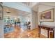 Spacious living room with terracotta floors, and views into dining room and backyard at 4892 Peregrine E Pt, Sarasota, FL 34231