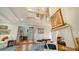 Bright living area with high ceilings, fireplace, and access to the entryway at 4892 Peregrine E Pt, Sarasota, FL 34231