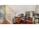 Home office with built-in shelving and hardwood floors at 4892 Peregrine E Pt, Sarasota, FL 34231