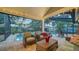 Covered patio with string lights overlooking the pool at 4892 Peregrine E Pt, Sarasota, FL 34231