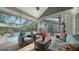 Relaxing screened pool area with patio furniture and lush landscaping at 4892 Peregrine E Pt, Sarasota, FL 34231