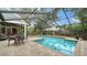 Refreshing screened pool and patio entertaining area at 4892 Peregrine E Pt, Sarasota, FL 34231