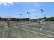 Community tennis courts with ample space for playing at 4892 Peregrine E Pt, Sarasota, FL 34231