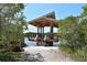 Enjoy the view from this waterfront gazebo at 4892 Peregrine E Pt, Sarasota, FL 34231