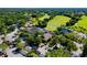 Aerial view of clubhouse, parking lot, and surrounding golf course at 5152 Marsh Field Ln # 117, Sarasota, FL 34235
