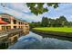 Clubhouse with patio overlooking the golf course at 5152 Marsh Field Ln # 117, Sarasota, FL 34235