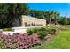 The Meadows community entrance with attractive landscaping and signage at 5152 Marsh Field Ln # 117, Sarasota, FL 34235