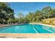 Relaxing community pool with plenty of lounge chairs at 5152 Marsh Field Ln # 117, Sarasota, FL 34235