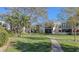 Paved walkway meandering through a beautifully landscaped community at 5152 Marsh Field Ln # 117, Sarasota, FL 34235
