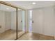 Bright entryway with mirrored closet doors and tile flooring at 5152 Marsh Field Ln # 117, Sarasota, FL 34235