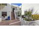 Condo building with courtyard entrance, brick pavers, and lush landscaping at 5152 Marsh Field Ln # 117, Sarasota, FL 34235