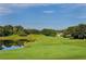 Golf course green next to a pond at 5152 Marsh Field Ln # 117, Sarasota, FL 34235