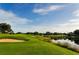 Golf course with sand trap and water at 5152 Marsh Field Ln # 117, Sarasota, FL 34235